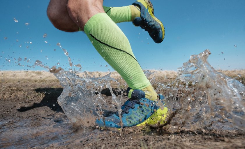 Sport running man in cross country trail run